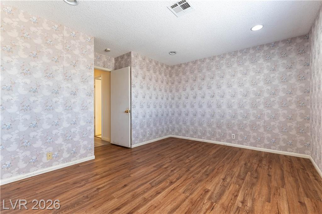 Primary bedroom opening onto a balcony